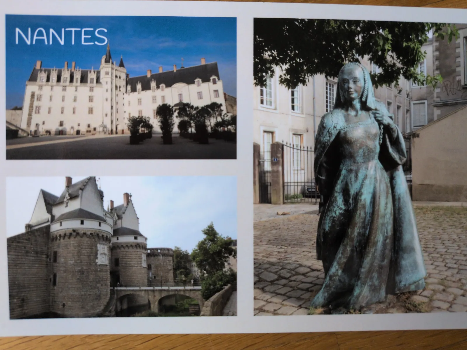 Postkarte von Nantes mit Ansichten eines Schlosses und einer Bronzestatue einer Frau.