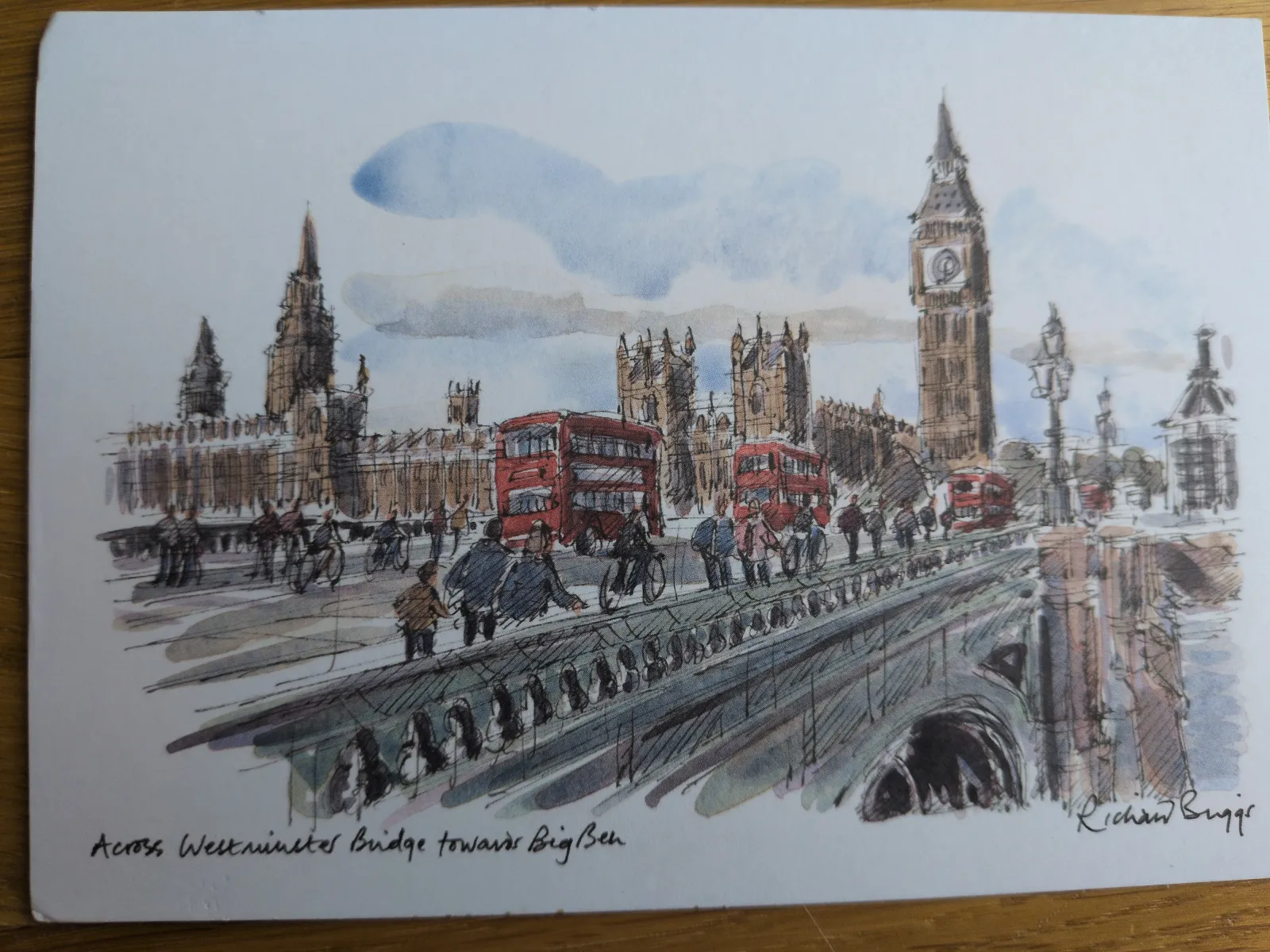 Ein skizzenhaftes Aquarell zeigt die belebte Westminster Bridge in London mit roten Bussen, den Houses of Parliament und dem Big Ben im Hintergrund.