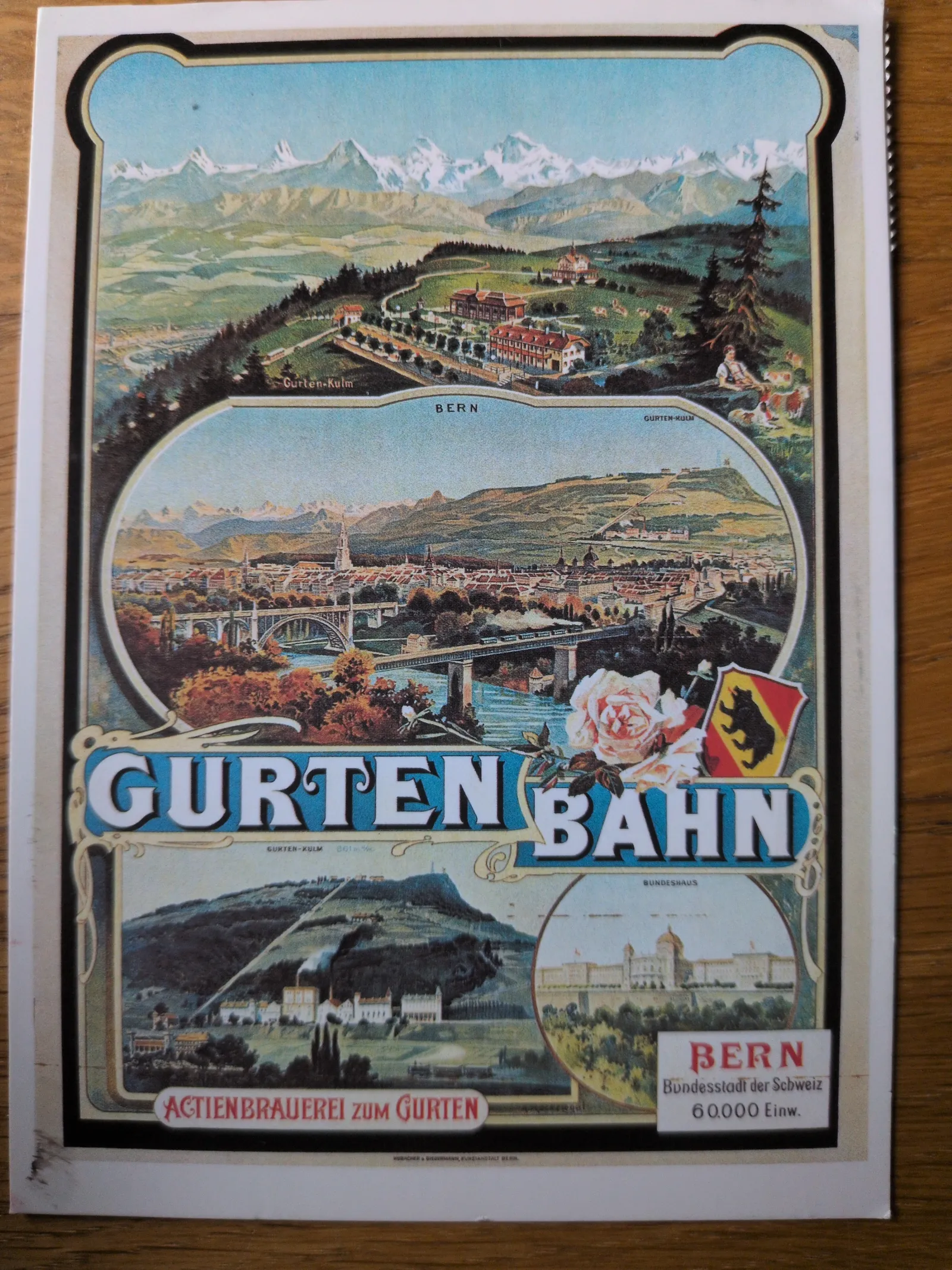 Ein altes Werbeplakat zeigt Panoramen der Stadt Bern, der Gurtenbahn und der umliegenden Alpenlandschaft.